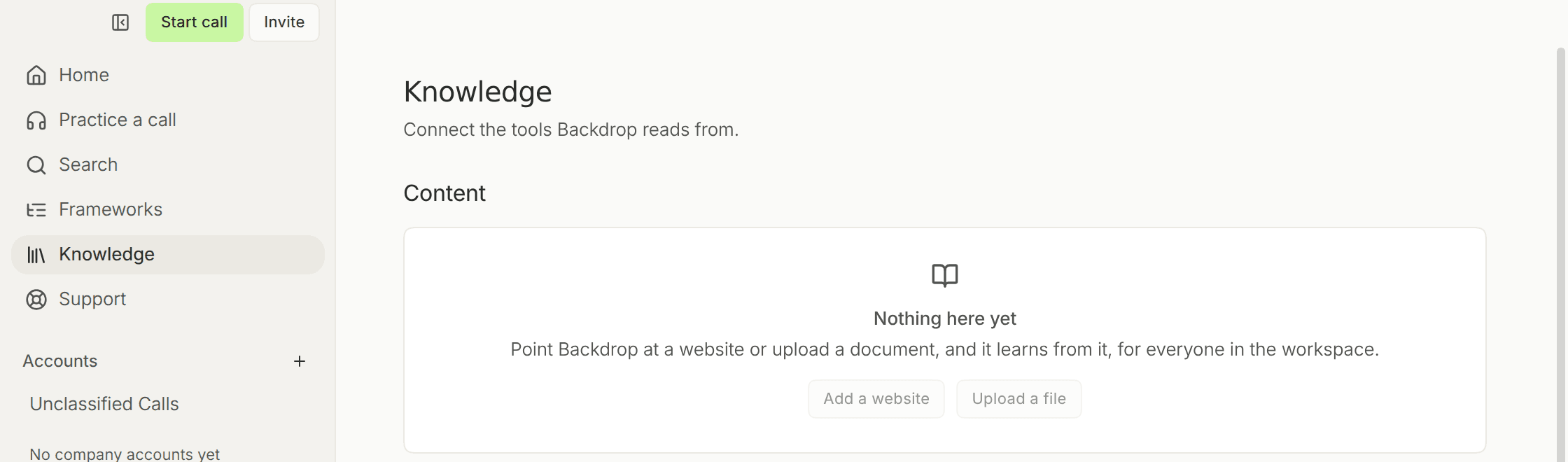 The Knowledge page with Knowledge selected in the sidebar, and an empty Content section reading Nothing here yet, with Add a website and Upload a file buttons